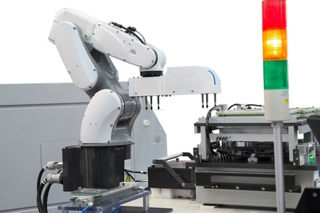 Robot picking printed circuit boards in semiconductor industry